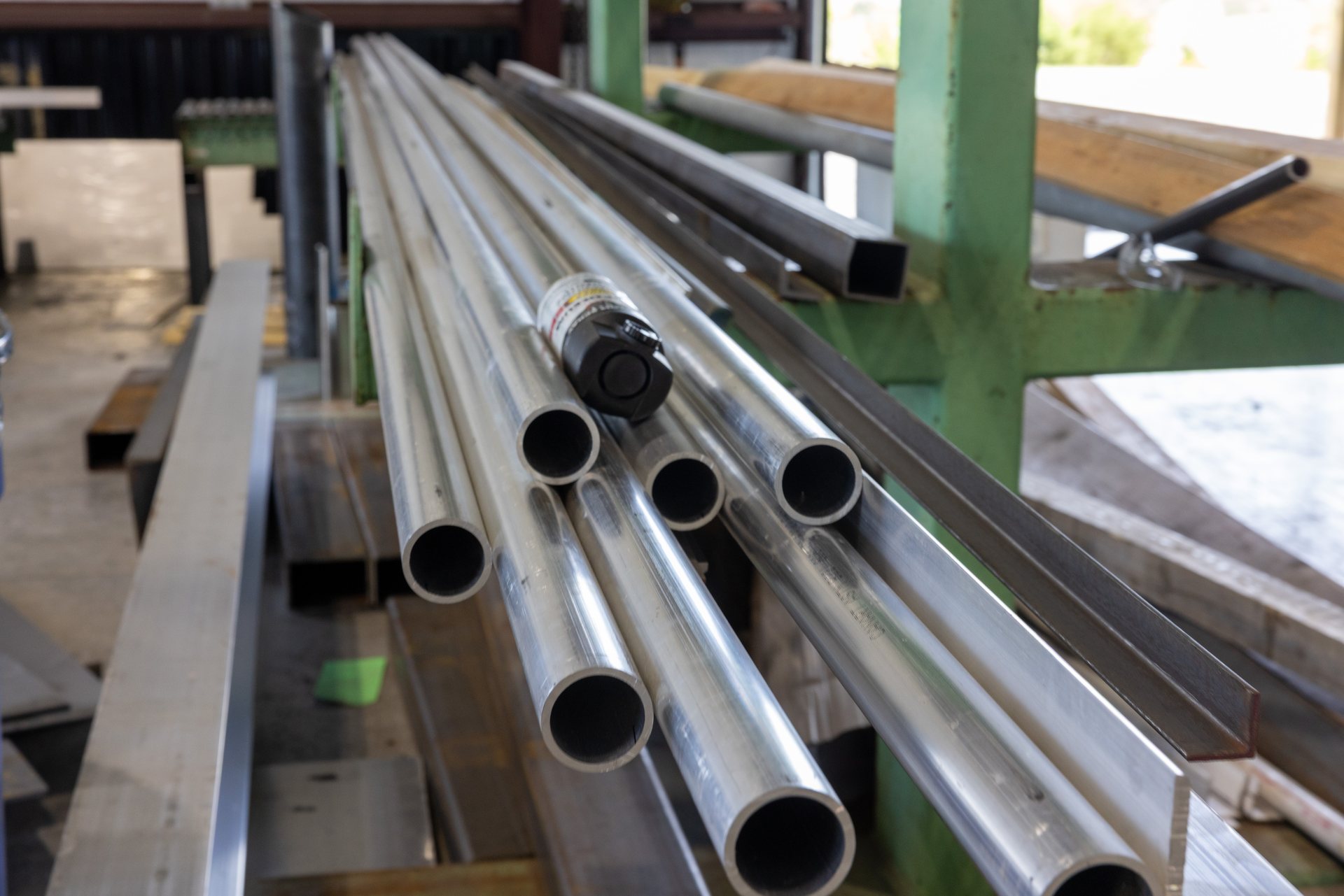 Aluminum round tube and angle stock racked at the Middletown, VA welding shop