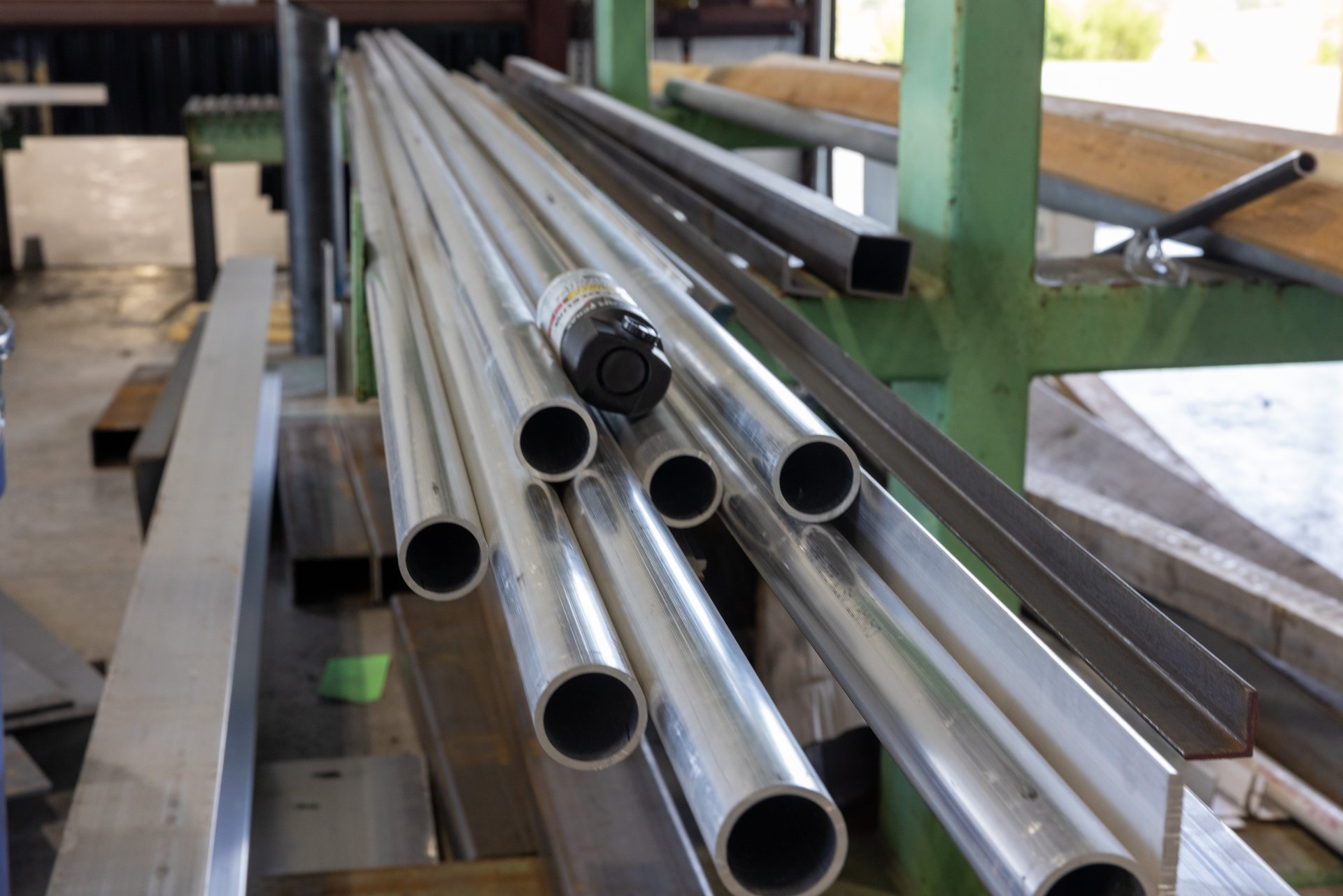 Aluminum round tube and angle stock racked at the Middletown, VA welding shop