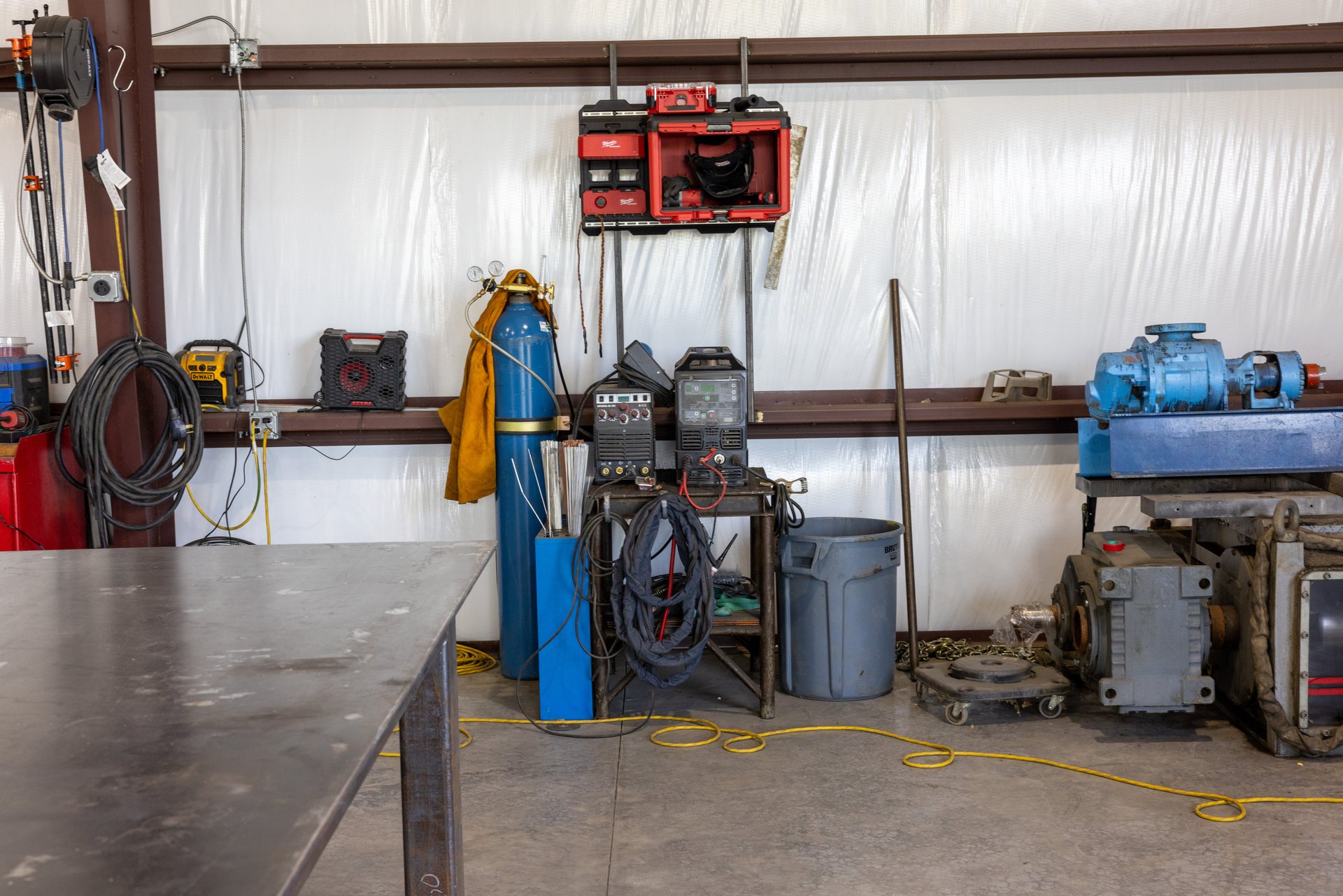 Industrial pump and gearbox staged for repair at the Middletown, VA welding shop