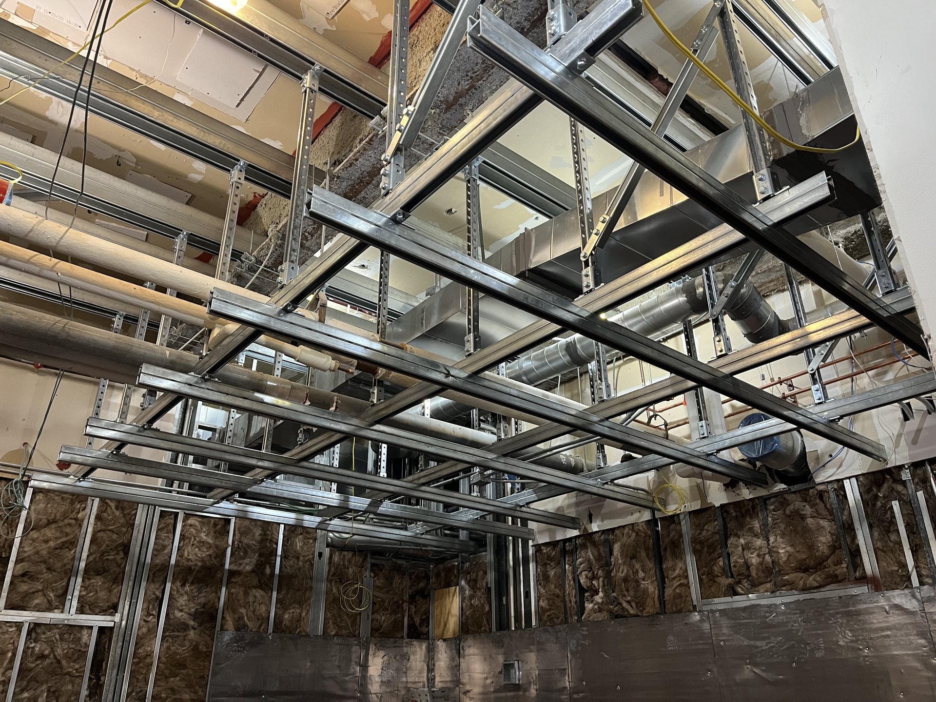 Fabricated overhead steel support grid for ductwork and piping in a Virginia facility