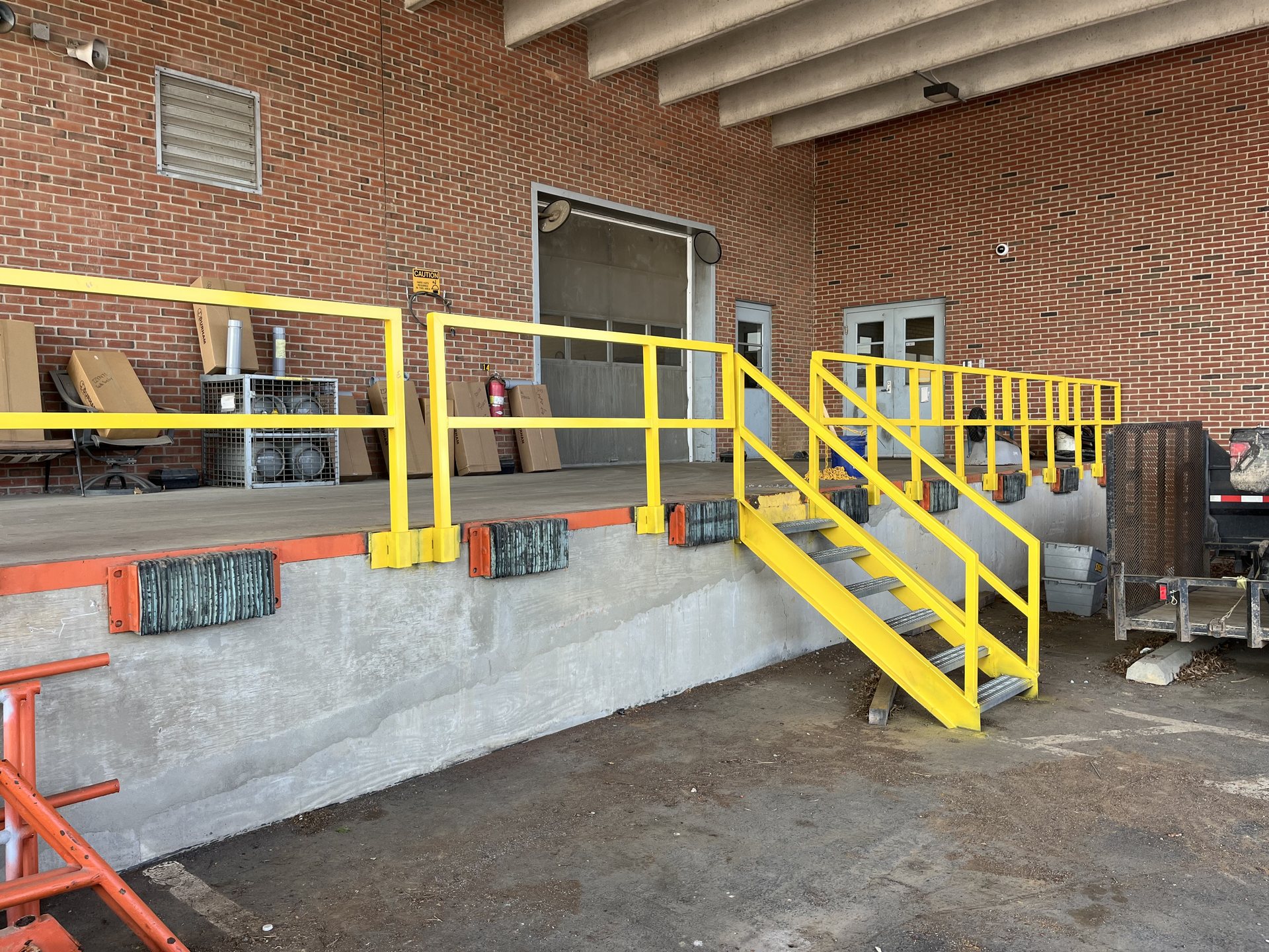 Safety yellow loading dock guardrail and stairs fabricated and installed near Winchester, VA