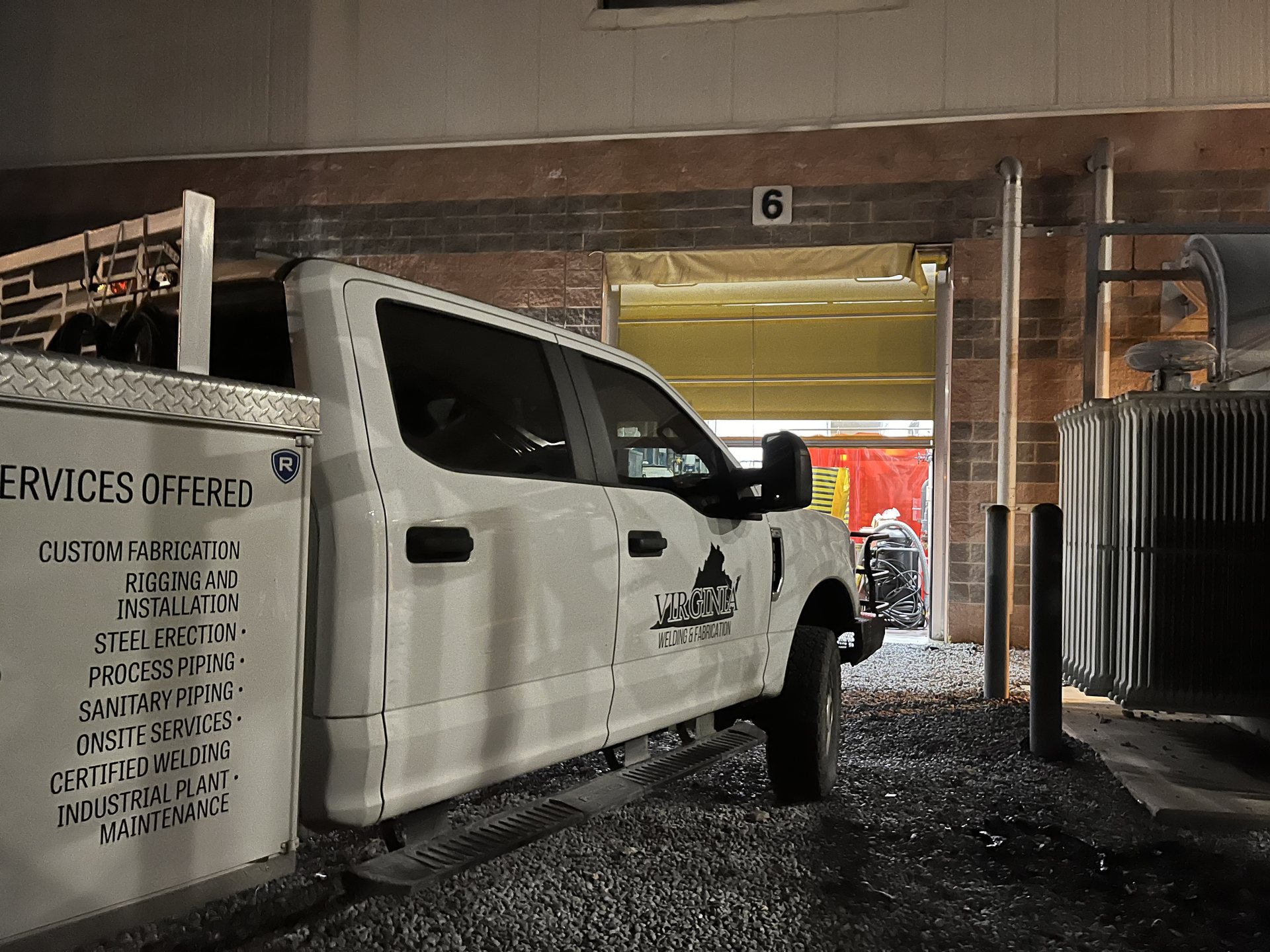 Virginia Welding and Fabrication mobile welding truck at a plant loading dock at night