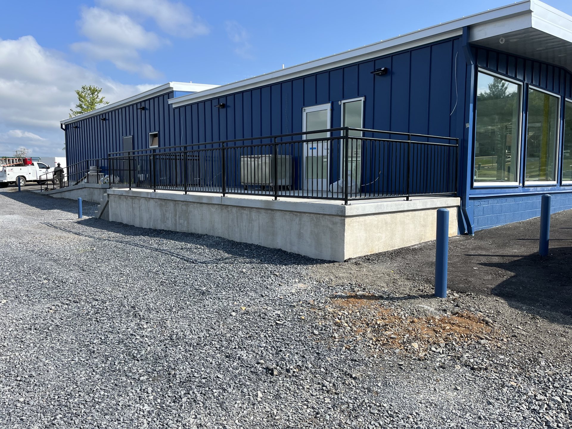 Black steel railing on a concrete equipment platform fabricated in Virginia